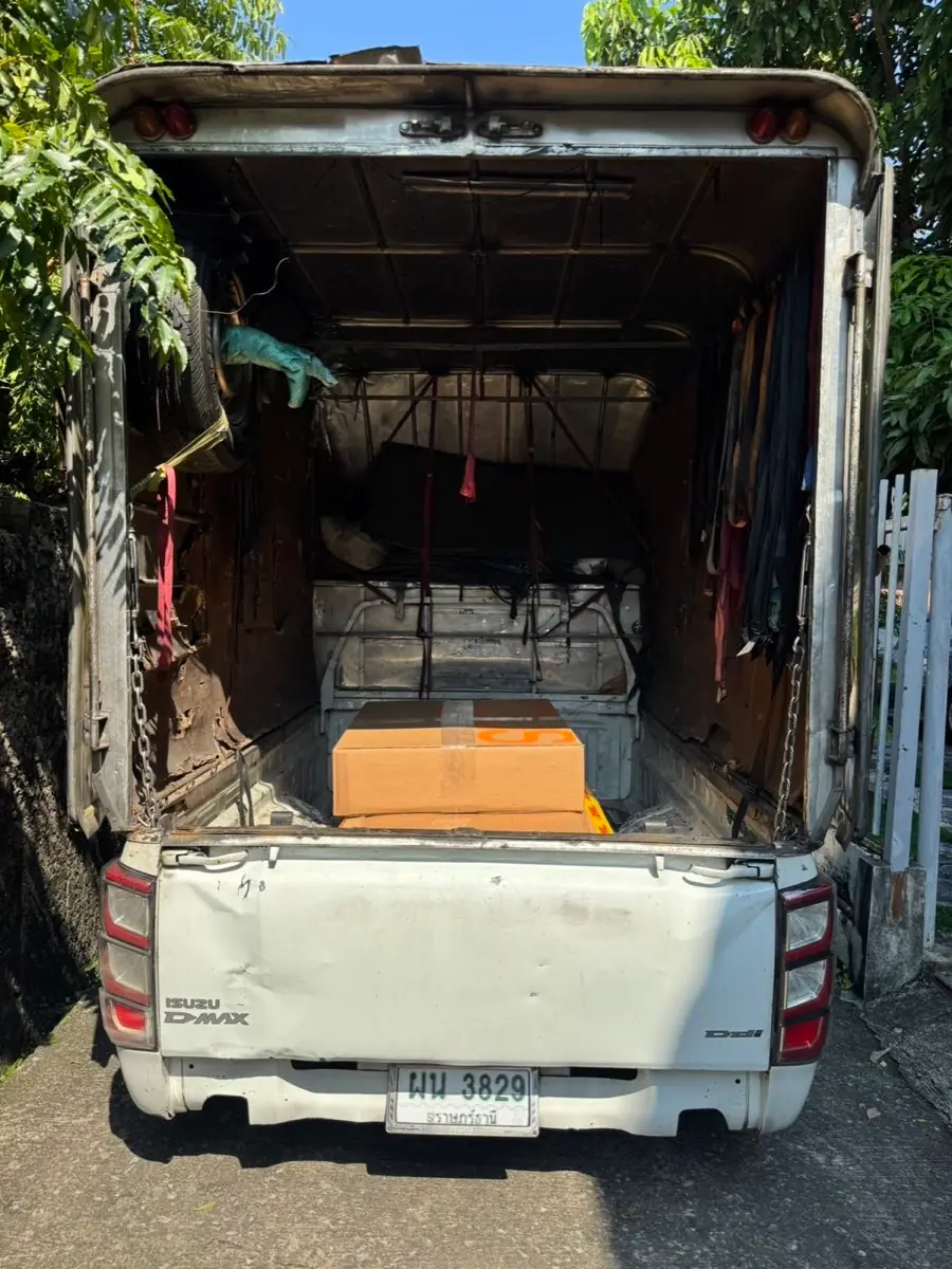 Box truck carrying boxed goods on a pallet, from the tailgate